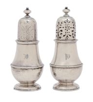 A pair of George I silver casters and covers, one pierced, the other blind, contemporary initials on