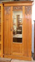 An Edwardian Art Nouveau walnut wardrobe, trade label of G. Hardy & Co House Furnishers Carrington