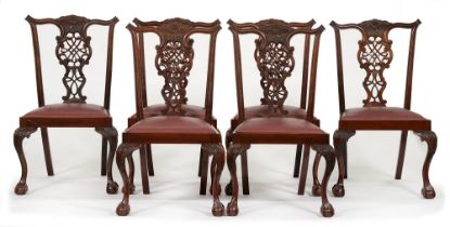 A set of six Victorian mahogany dining chairs, with carved and pierced splat, on carved legs and