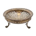 An Edwardian saw pierced silver fruit bowl, with gadrooned rim, on three paw feet, 20.5cm diam, by