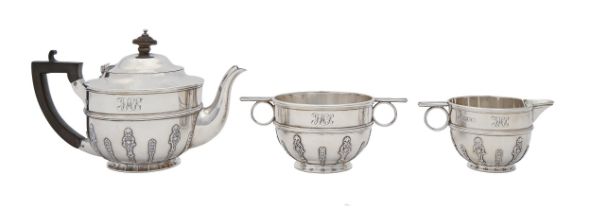 A Victorian silver bachelor's tea service, applied with lambrequin, teapot 12cm h, by Aldwinckle &