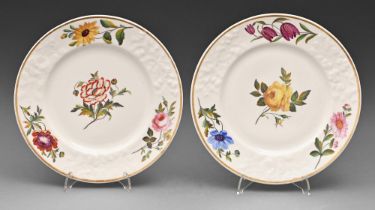 A pair of Chamberlain's Worcester moulded dessert plates, c1825, painted with four flowers and gilt,