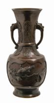 A Japanese bronze vase, Meiji period, cast from two scenes of birds and peach boughs, 30.5cm