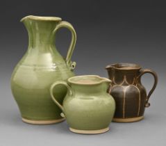 Studio pottery. June Mullarkey (1947 - ) - Three jugs, glazed stoneware, 29cm h and smaller,