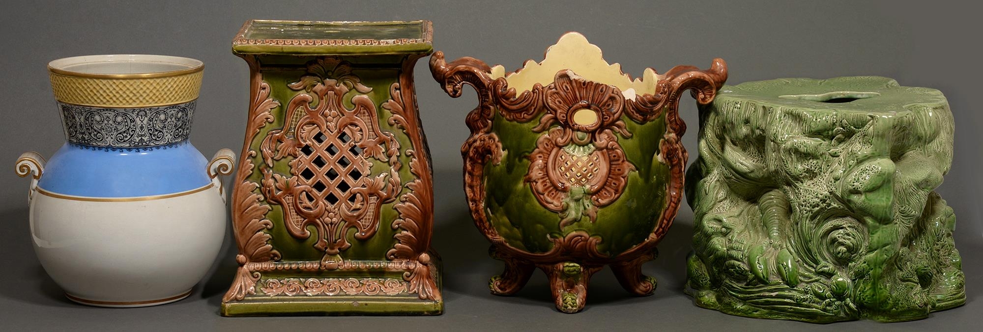 A majolica jardiniere and two pedestals, late 19th c, and a vase (4) Faults