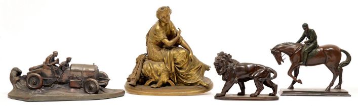 A brass classical figure, horse and rider figure, faux bronze lion and replica 1920s inkwell and pen