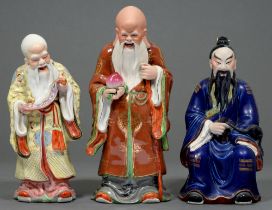 Three  Chinese porcelain figures of immortals,  36cm and smaller