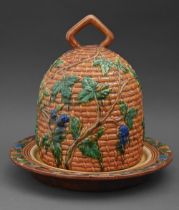 A  reproduction majolica bee skep cheese dish and cover, 35cm h