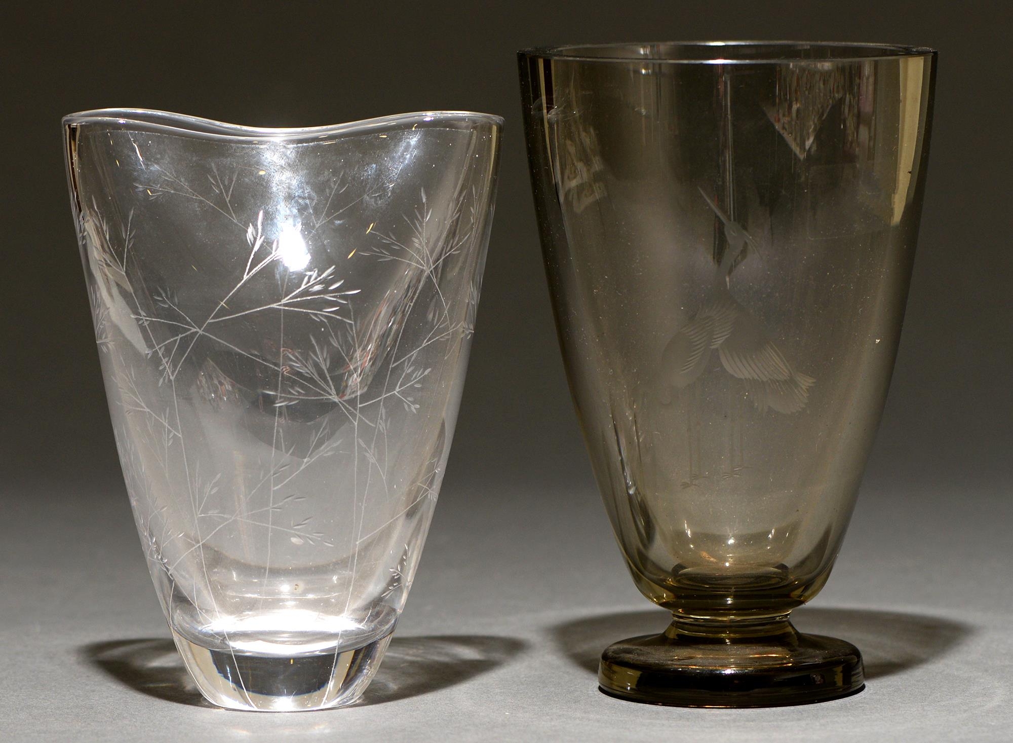A Kosta green glass vase, engraved with grasses, 19cm h and  another vase engraved with herons, 20cm