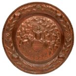 A copper plaque, early 20th c, 46cm diam