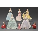 A Royal Doulton porcelain figure of Julie, three miniature Doulton figurines and four Coalport