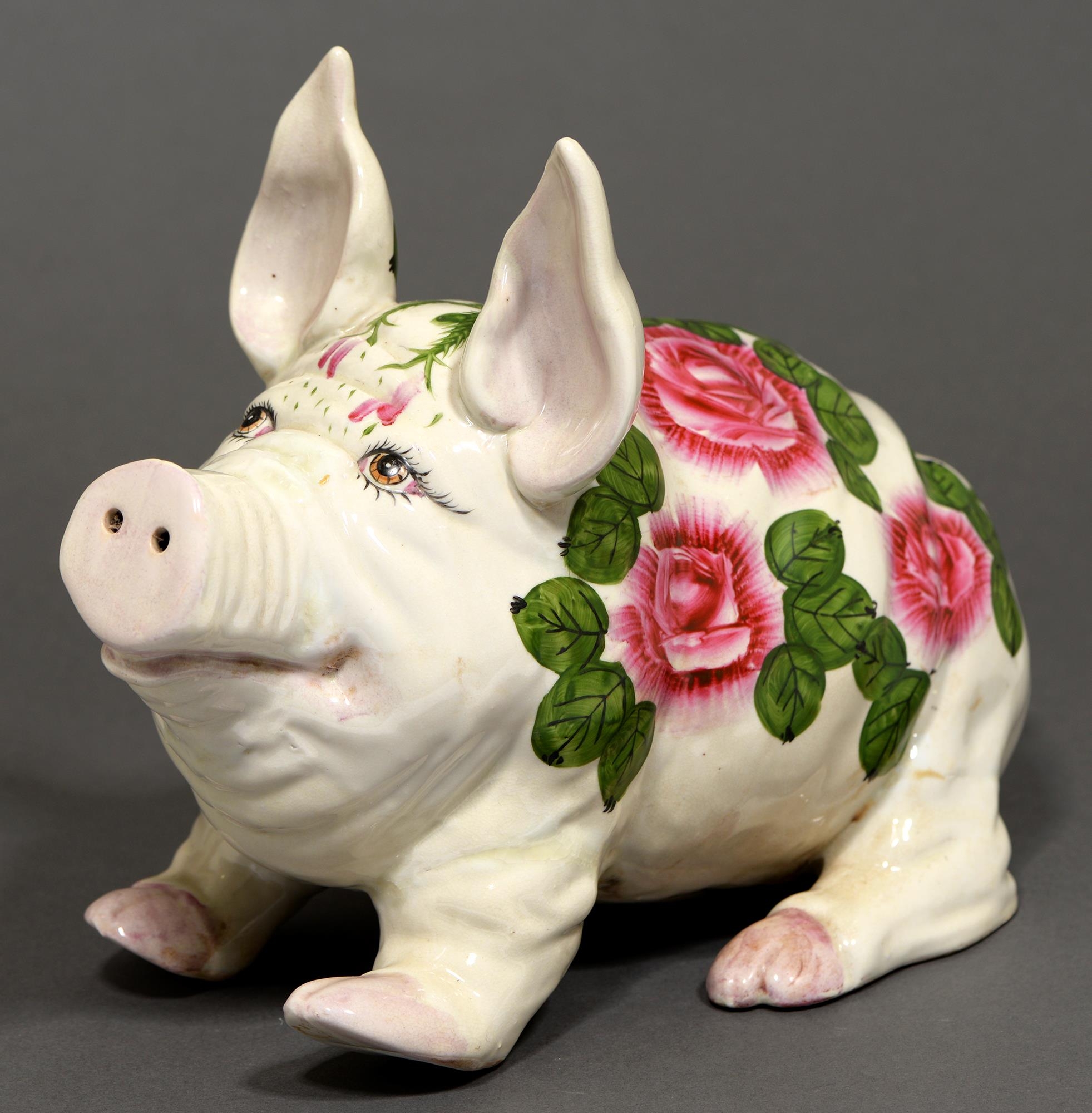A reproduction Wemyss ware seated pig,  26cm h; 36cm l