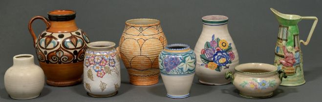 Eight earthenware vases and jugs, to include Poole, Langley, Denby and Charlotte Rhead (8)