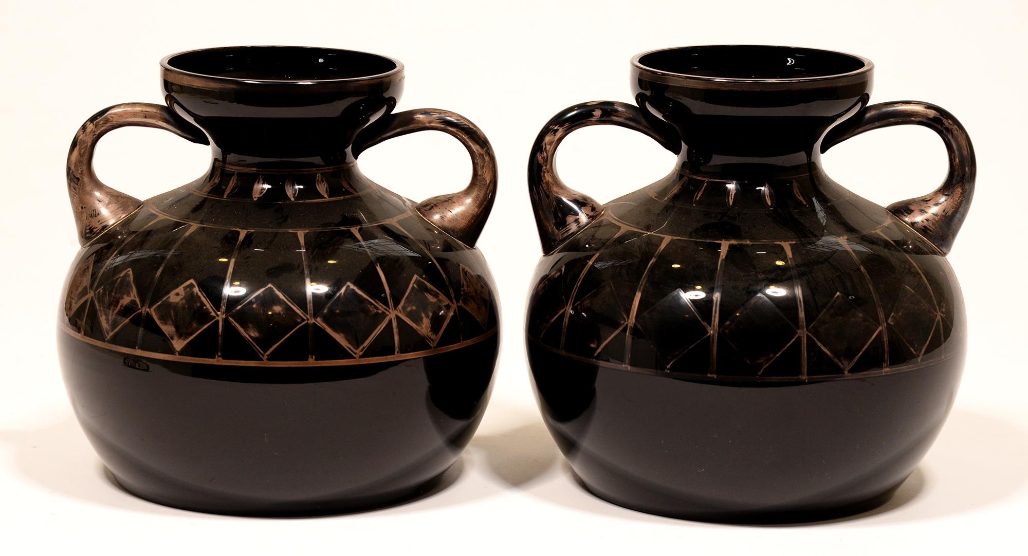 A pair of Michel Herman French Art Deco black glass vases, with silvered decoration, 18.5cm h,