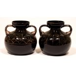 A pair of Michel Herman French Art Deco black glass vases, with silvered decoration, 18.5cm h,