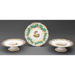 A pair of Minton fruit stands, with painted landscapes and Rockingham plate, 23cm diam (3) Plate