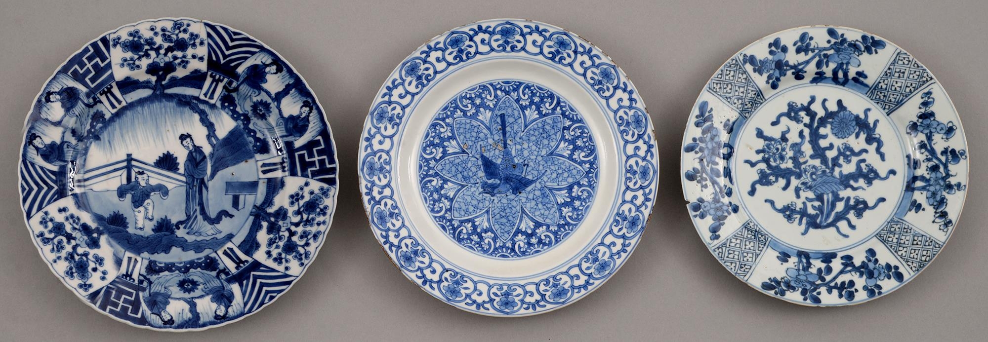 Three Chinese blue and white plates, Kangxi period, painted with a lady and jumping boy or other