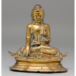 A brass sculpture of Buddha, Mandalay, Burma, 19th c, with glass eyes, 21cm h Top of head damaged,