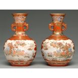 A pair of Kutani ware vases, early 20th c, the flared neck with mask handles and painted with panels