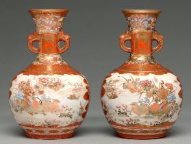 A pair of Kutani ware vases, early 20th c, the flared neck with mask handles and painted with panels