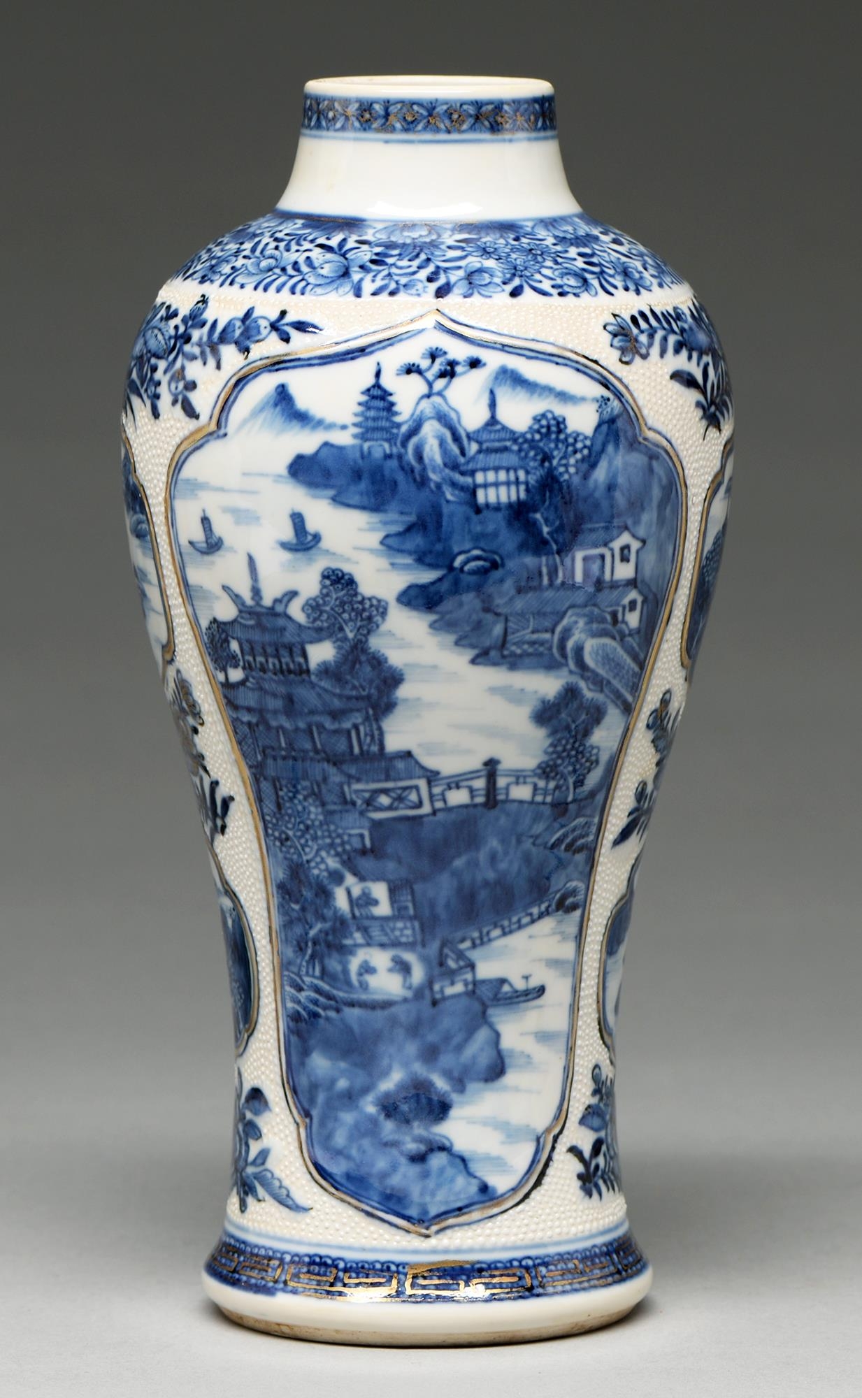 A Chinese blue and white baluster vase, late 18th c, painted with landscapes in six slightly