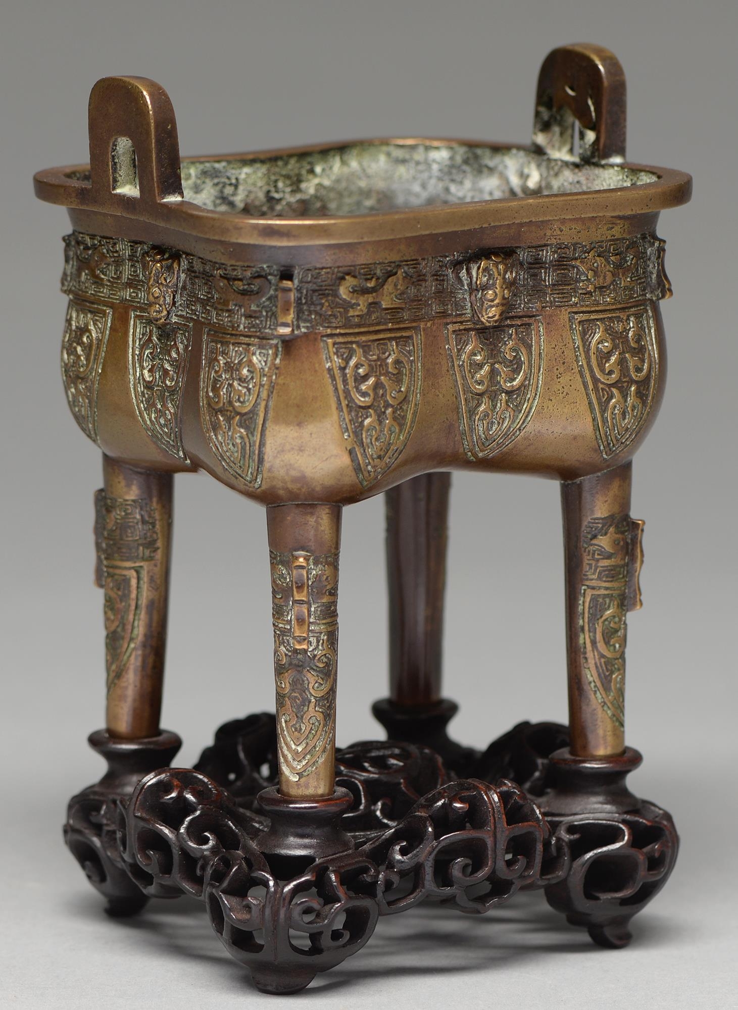 A Chinese bronze archaistic vessel, Ding, 20th c, the sides cast with mask and stylised animals on - Image 3 of 3