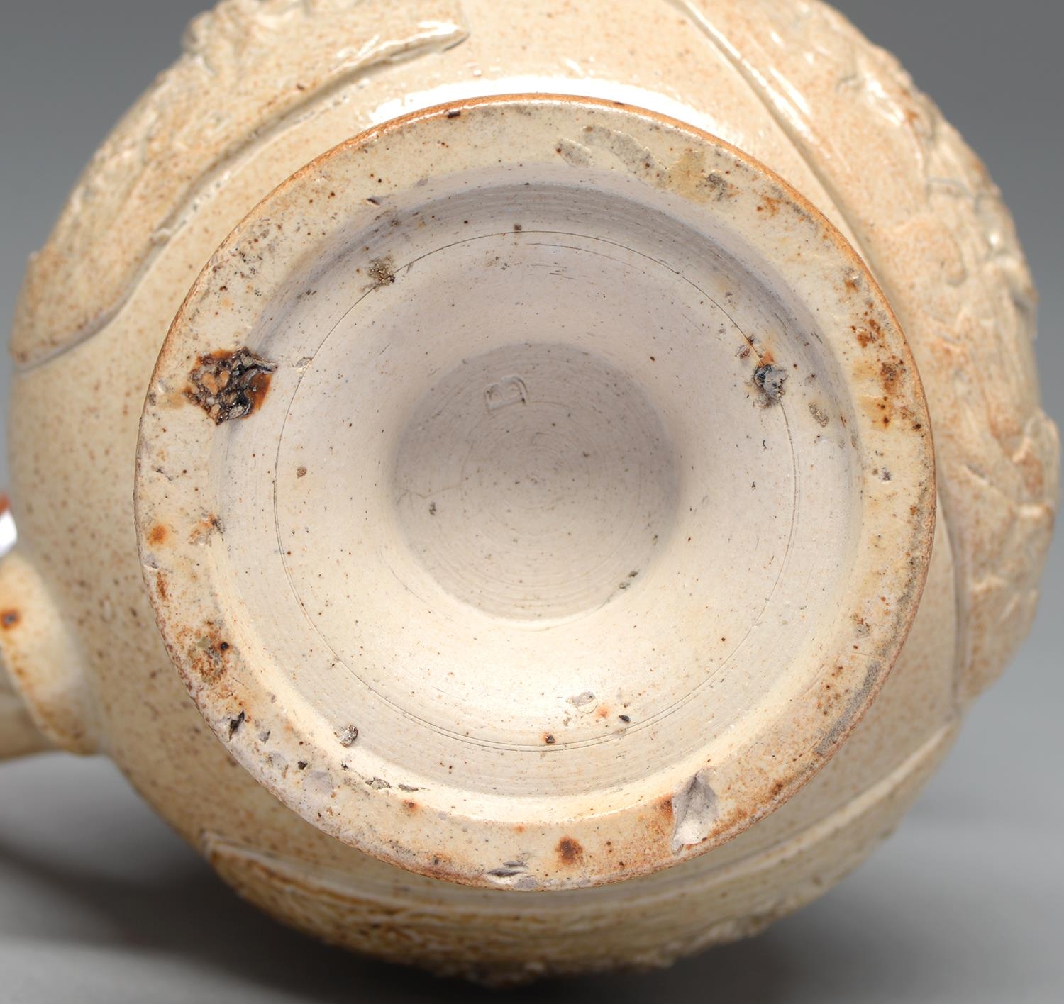 A Derbyshire saltglazed brown stoneware puzzle jug, probably Chesterfield, c1830, with three - Bild 2 aus 2