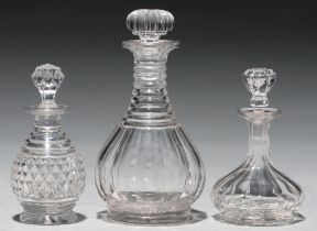 Three Victorian cut or faceted glass scent bottles and stoppers, 10-14cm h Undamaged