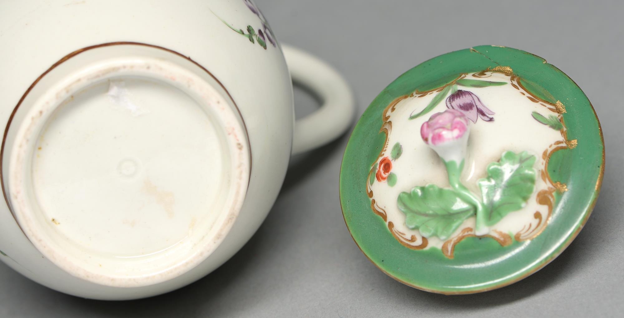 A Worcester hot milk jug and cover, c1770, enamelled beneath a shaped apple green and gilt rococo - Image 2 of 2