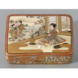 A Satsuma ware box and cover, Meiji period, the cover enamelled with a woman in an interior