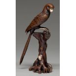 A  bronze and mixed metals okimono of a parrot,   perched on a gnarled tree stump, 19.3cm h,