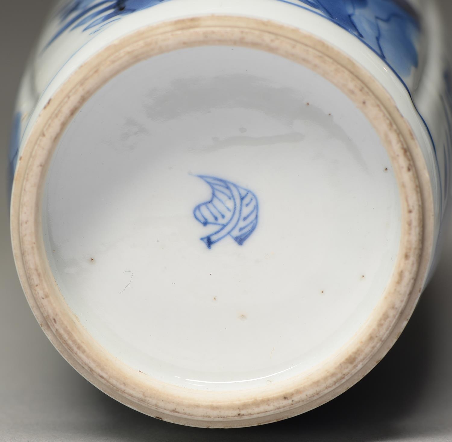 A Chinese blue and white vase, Kangxi period, painted with fruiting or flowering plants growing from - Image 2 of 2