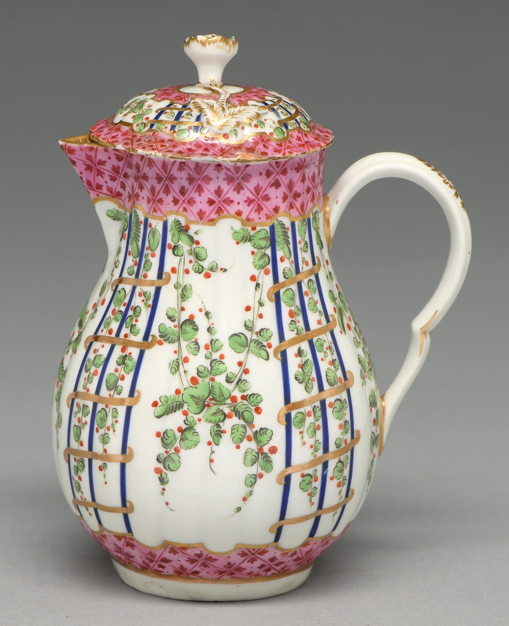 A Worcester hot milk jug and cover, c1775, enamelled in Sevres style with the Hop Trellis pattern,