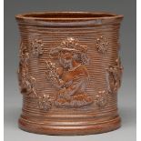 A saltglazed brown stoneware tobacco jar, possibly Yorkshire, c1830, sprigged with a lady with