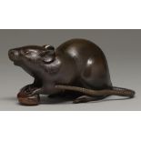 A Japanese bronze okimono of a rat, Meiji period, with finely chiselled fur, the rodent's fore