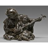 A Japanese bronze sculpture of a father teaching his son to play the shamisen, Meiji period, rich
