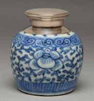 A Chinese blue and white jar, 19th c, painted with shou character and flowers, later silver mount