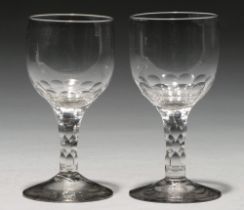 A pair of glass goblets, c1790, the ovoid bowl on faceted stem and conical foot, 16cm h Undamaged