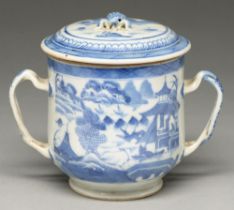 A Chinese blue and white two handled cup and cover, early 19th c, with entwined handles, painted