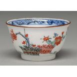 A Kakiemon cup, Edo period, early 18th c, enamelled with banded hedge and blossoming prunus and