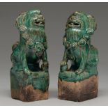A pair of Chinese tileworks type glazed biscuit dog of Fo incense burners, probably early 20th c,