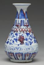 A Chinese underglaze blue and red vase, painted in Ming style with formal band of flowers and