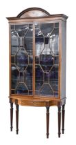 A fine Victorian mahogany, satinwood and inlaid  cabinet, the arch centred cornice decorated with