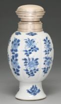 A Chinese blue and white vase, 18th c, lobed ovoid on flared foot, painted with flowering plants,