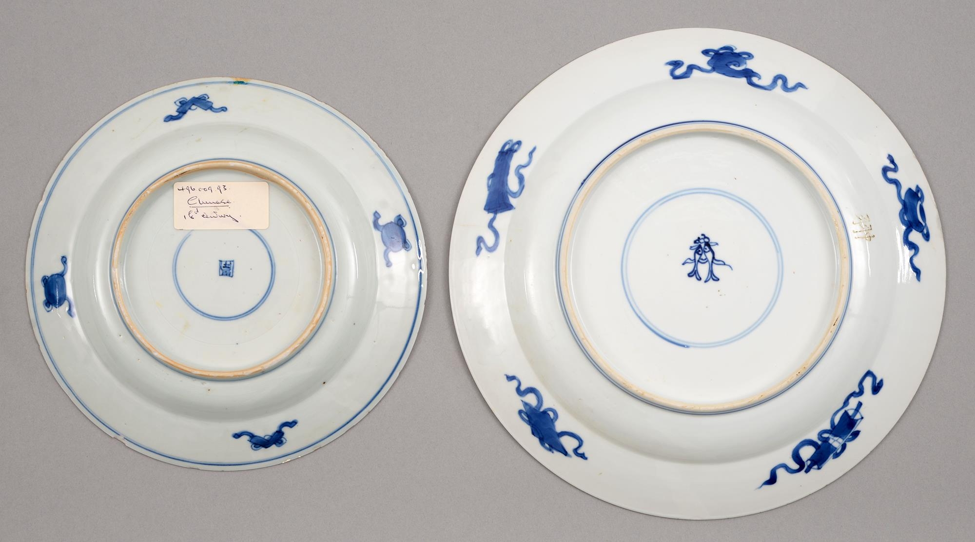 Two graduated Chinese blue and white plates, 18th c, painted with dragon and carp rising from - Image 2 of 5