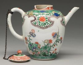 A Chinese famille verte teapot and cover, Kangxi period, enamelled with flowers sprouting from