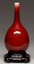 A Chinese flambe glazed vase, 20th c, of slender bulbous form, the glaze thinning slightly at the