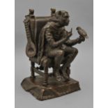 A bronze sculpture of a jester training a bird, cast from a model by F Rosse, late 19th c, dark