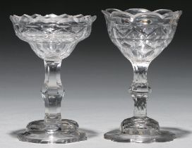 Two sweetmeat glasses, c1770, with facet cut ogee bowl, one with scalloped rim, on faceted stem