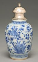 A Chinese blue and white wrythen fluted vase, 19th c, painted with flowering plants, later silver